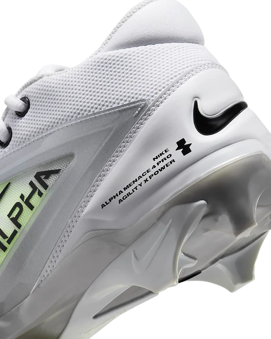 Close-up of Nike Alpha Menace 4 Pro football cleat showcasing white upper, black Nike swoosh, and molded studs for agility and power.